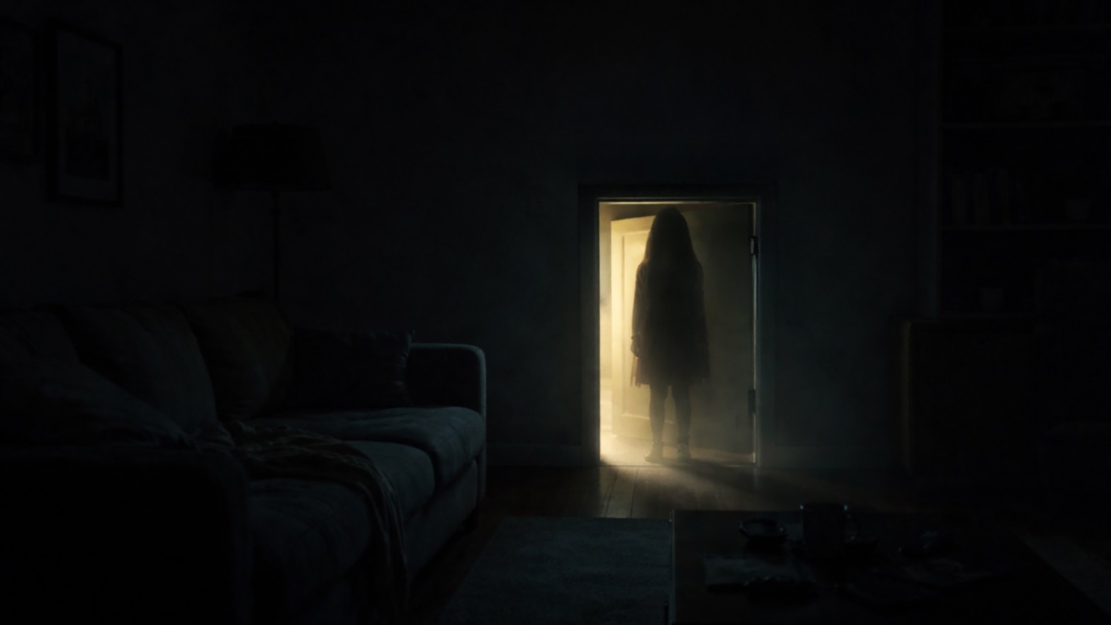 little girl standing in front of a short white basement door with a light glow creeping in from behind her